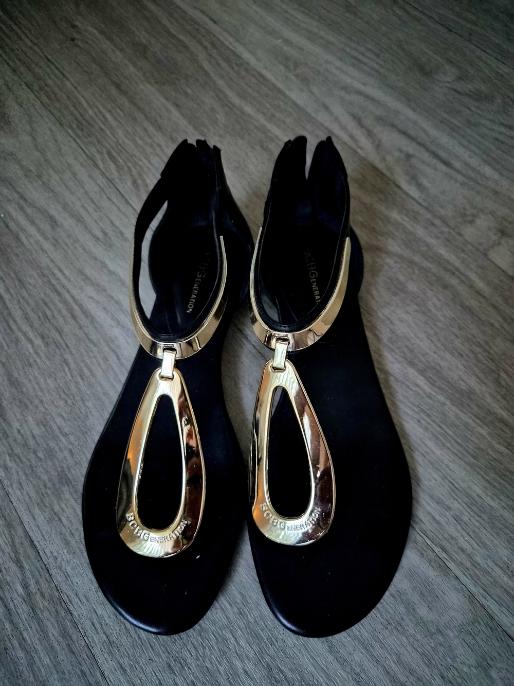 BCBGeneration Black Sandals with Gold Teardrop T-Strap